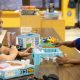 Kids Club counselor playing Don't Break the Ice with a young child who is laughing